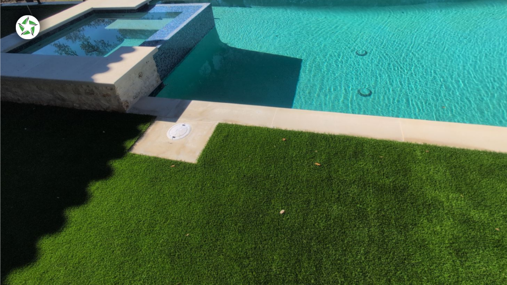 Turf around the pool bordering paver coping and a spa, a Lone Star Turf Texas project from Turf Around the Pool: Pavers vs. Concrete vs. Turf.
