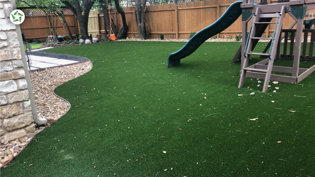 Leaves and twigs scattered across a playground turf lawn before a debris clear to maintain artificial turf, How to Clean and Maintain Artificial Turf (Without Wrecking It), Lone Star Turf Texas