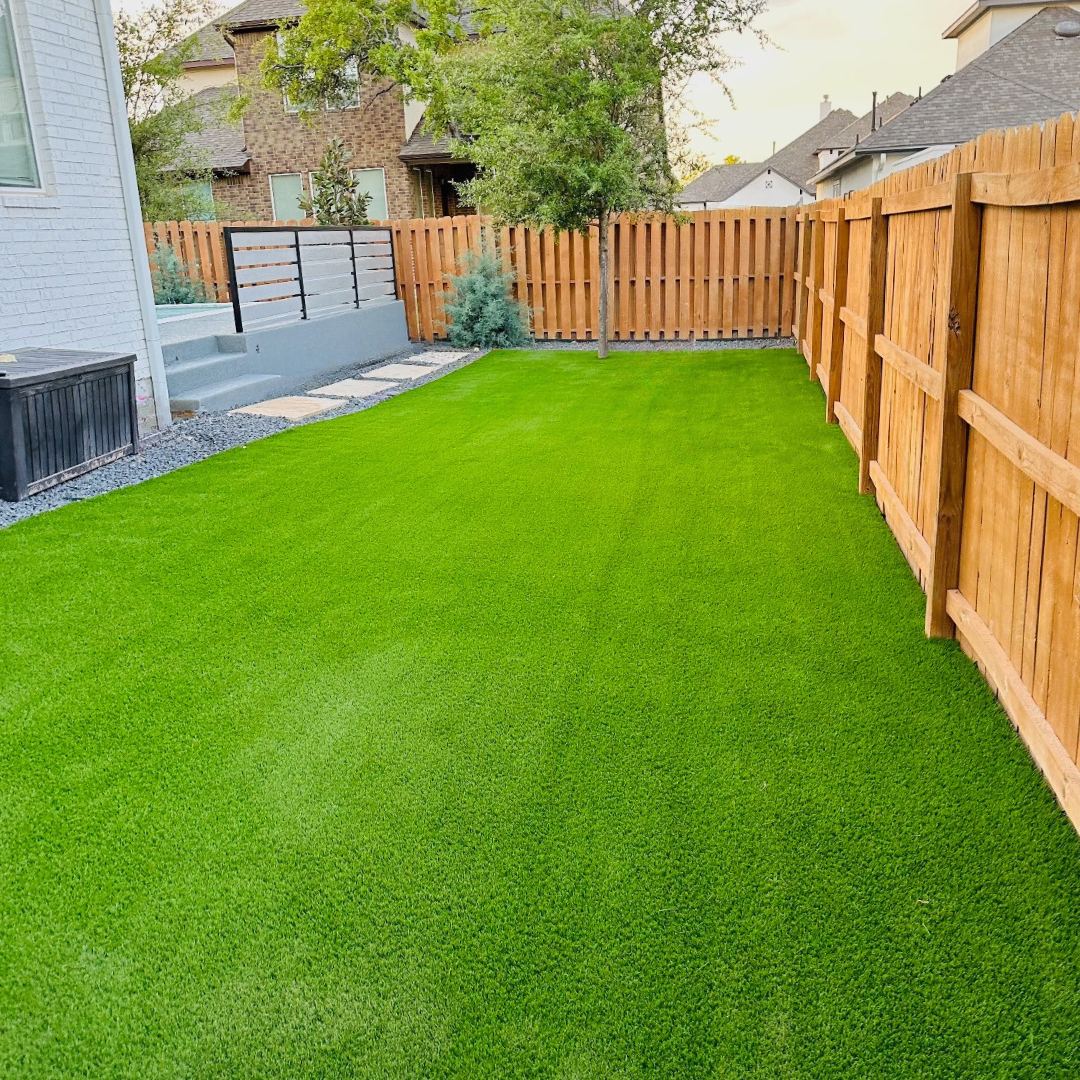 Top 5 Artificial Turf Installers in Dallas Fort Worth Artificial turf installed in a backyard surrounded by a wooden fence