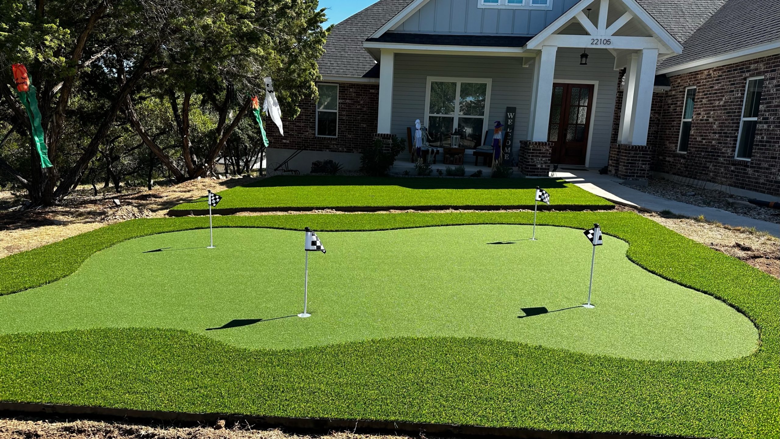 At home backyard custom putting green in Texas