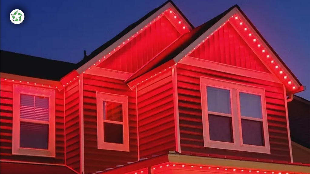 Red permanent outdoor lighting on home gables at dusk, Jellyfish Lighting vs. Professional Install: What Is "Permanent Outdoor Lighting"?, Lone Star Turf - Soffit Lighting 101: Jellyfish vs. Professional Outdoor Lighting