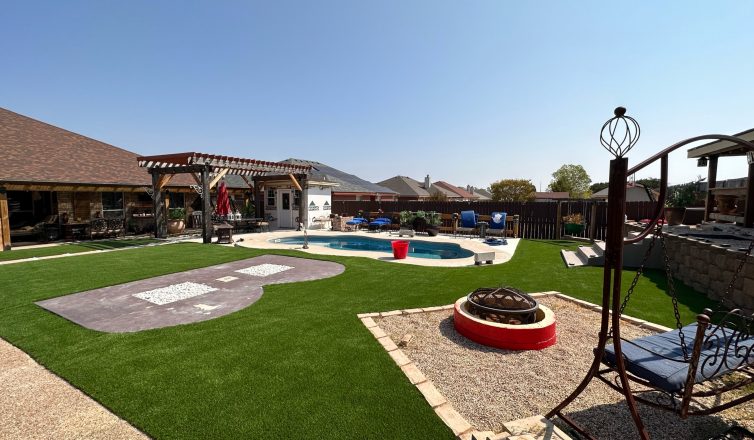 Backyard with artificial turf with zones for a pool, a pergola, a fire pit, and play.