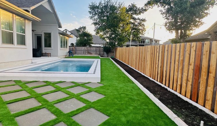 Backyard artificial turf design ideas with pavers by a pool.