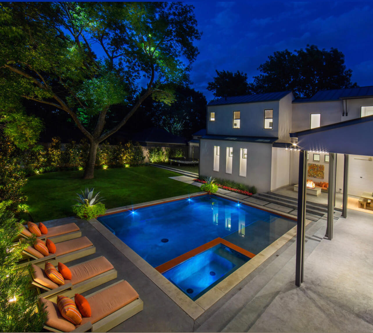 Beautiful outdoor lighting around a pool deck