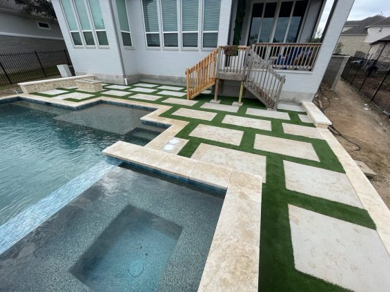 turf installation around walking stones